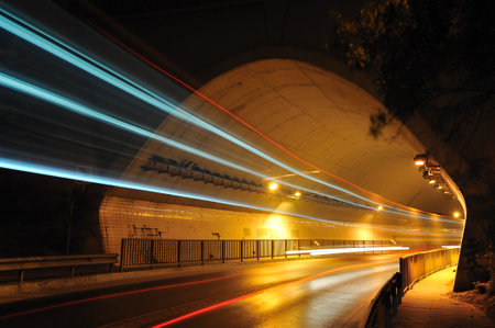 tunnel entrance on highway night vehicle crossings