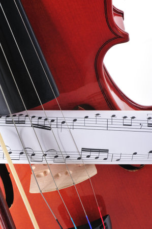 Close-up of violin and bow on a white background.の写真素材