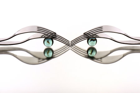 Fork with blue eyes on a white background. View from above.の写真素材