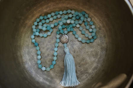 Singing bowl with mala chain for sound therapy