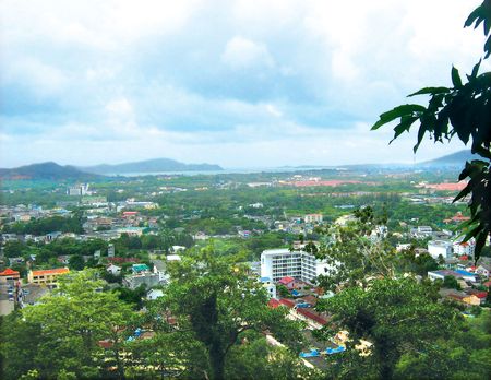 Aerial view of a township with clear blue sky and trees being the picture perfect frameの写真素材