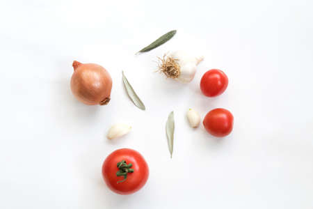 Tomatoes garlic and onion isolated on white background. Top view.の写真素材