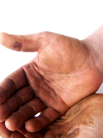 Image of hardworking hands held together, on a white background.  Vertical orientation.の写真素材