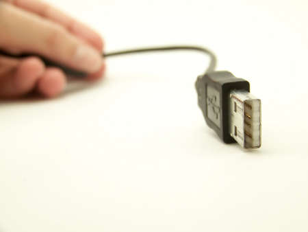 Image of a curved USB cable, with hand in background of image.  Horizontal orientation.