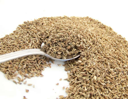 Image of dried anise being scooped up by a metal spoon.の写真素材