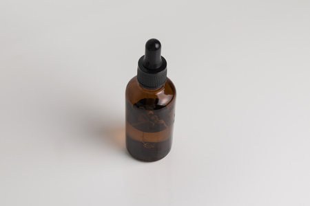 isolated brown glass bottle in brown color for medical and graphical use.の写真素材