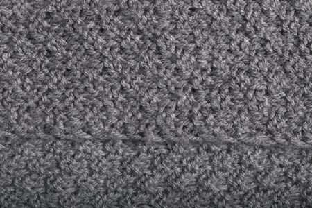 close up of a handmade knitted grey cashmere wool fabricの写真素材