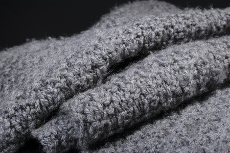 folded handmade gray cashmere wool fabric background.の写真素材
