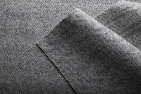 Grey herringbone tweed fabric, herringbone textile background for fashion designers. の写真素材
