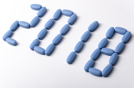 Creative 2018 new year concept made out blue medical tablets over a white background. の写真素材