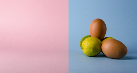 Isolated eggs and lemon concept over a creative modern background. の写真素材
