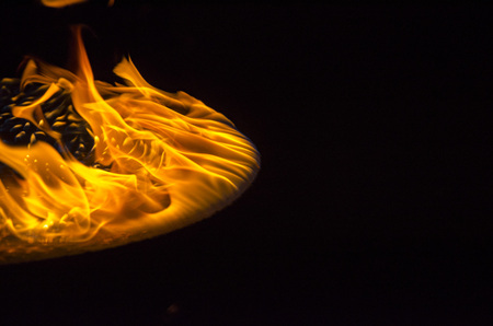 Isolated burning flame or fire on black background. の写真素材