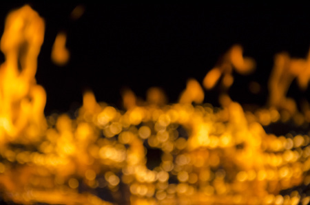 bokeh of flame of fire on black background.の写真素材