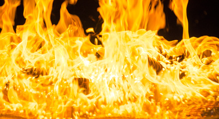 Isolated burning flame or fire on black background. の写真素材