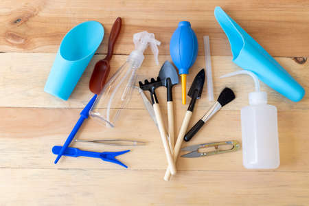 Garden mini tools set with wooden backgroundの写真素材