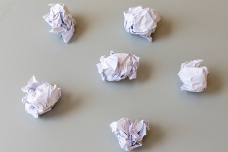 Crumpled paper balls on a gray backgroundの写真素材
