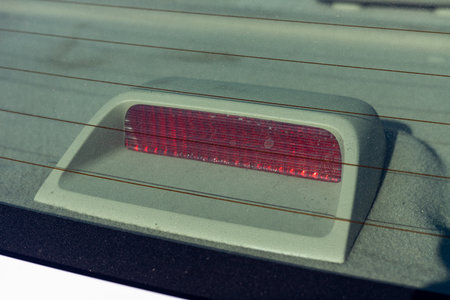 Brake light in the rear window of a carの写真素材