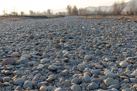 Dry river pebbles and stones in the winterの写真素材