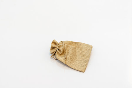 Brown empty sack small bag isolated on white backgroundの写真素材