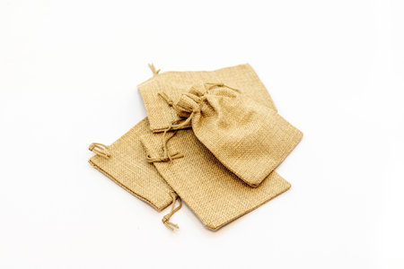 Jute sack bags for gifts isolated on white background. selective focusの写真素材