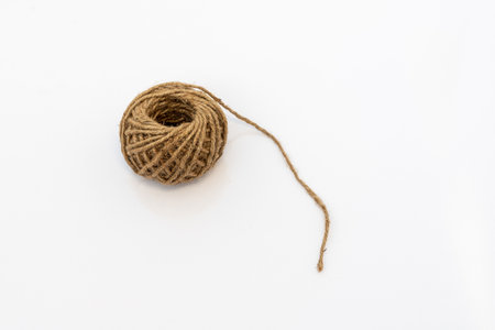 Jute rope bundle on white isolated backgroundの写真素材