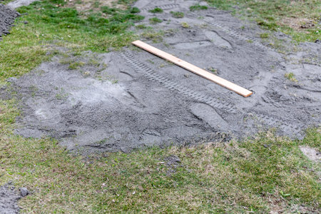 Using a sand to level the lawn at homeの写真素材