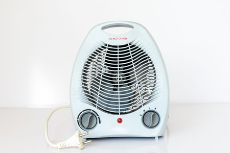 Electric fan heater on white isolated backgroundの写真素材