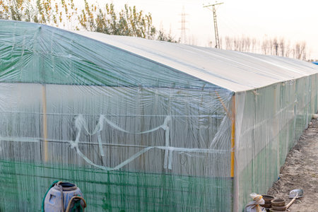 Plastic tunnel greenhouse for plants closeup.の写真素材