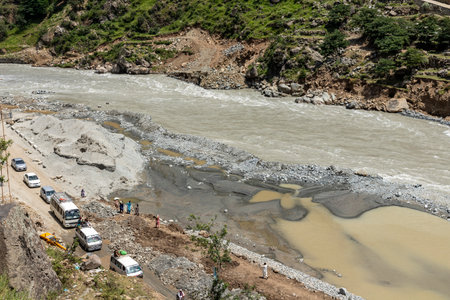 Heavy flood in river swat damaged the road and markets at bahrain swat valley: Bahrain swat, Pakistan - June 12, 2023.のeditorial素材