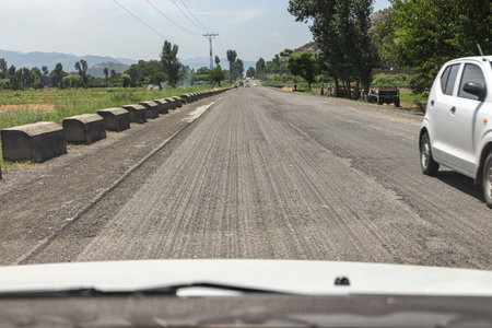 Road work of partial removal the top layer for replacement and construction of new asphalt road.の写真素材