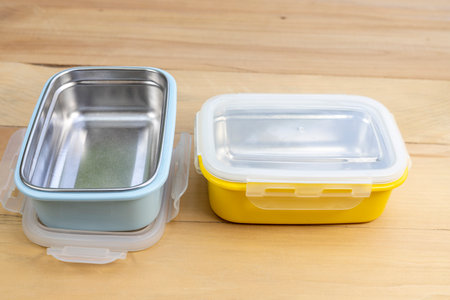 Metal empty stillness steel lunch boxes with on a wooden backgroundの写真素材