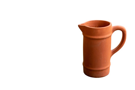 Handmade clay jug isolated on white backgroundの写真素材