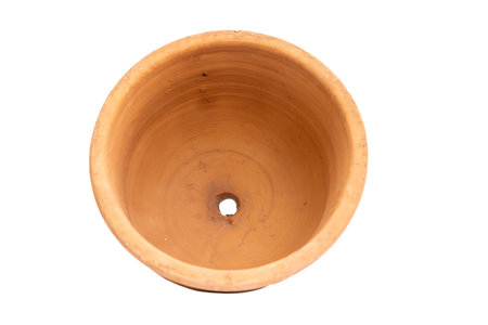 Large handmade flower pot with drainage hole isolated on white backgroundの写真素材
