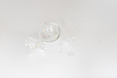 Broken glass vase with sharp edges isolated on white backgroundの写真素材