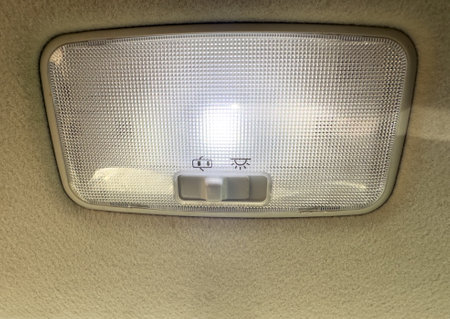 Close up of a car roof or ceiling light illuminated.の写真素材