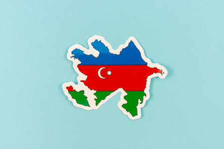 Azerbaijan Map Shaped with National Flag Colors on Blue Backgroundの写真素材