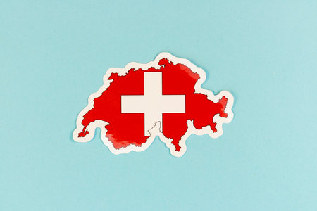 Switzerland Map with Swiss Flag Colors on Blue Backgroundの写真素材