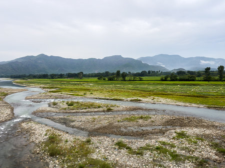 River Winding Through a Green Countryside in Pakistanの写真素材