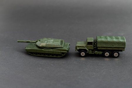 Green military tank model with military truck modelの写真素材