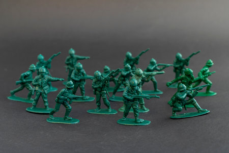 Green plastic army men in combat posesの写真素材