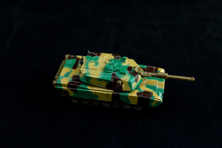 Camouflage tank model on black backgroundの写真素材