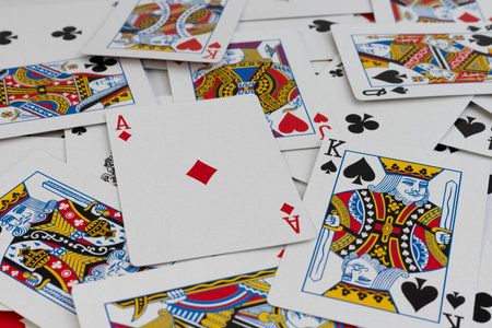 Scattered Playing Cards Close-Up â Ace of Diamonds Focusの写真素材