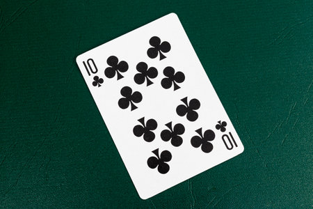 Ten of Clubs Playing Card on Green Poker Table. Top View.の写真素材