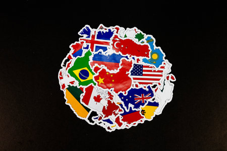 World Map Stickers of Countries with National Flags on Black Backgroundの写真素材