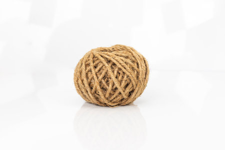 Close-Up of Jute Twine Ball on White Backgroundの写真素材