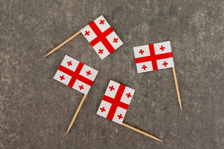 Georgian Toothpick Flags Arranged in Diagonal Pattern on Grey Backgroundの写真素材