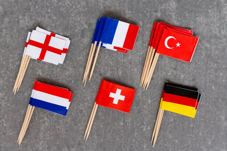 Collection of European Country Flag Toothpicks on Grey Surfaceの写真素材