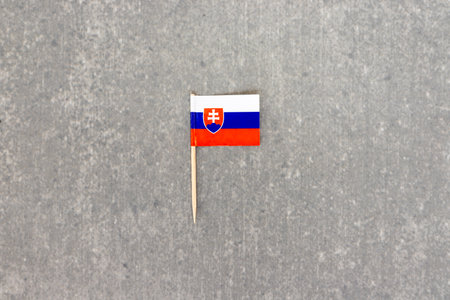 Slovakia Flag Toothpick on Gray Concrete Backgroundの写真素材