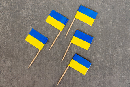 Five Ukraine Mini Flags Arranged on Gray Backgroundの写真素材