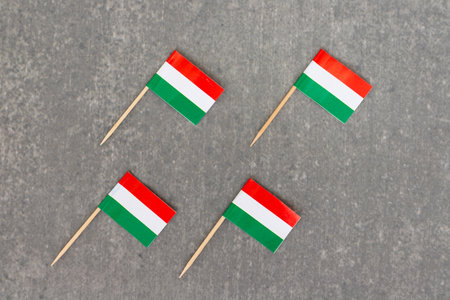 Four Hungarian Flags in Diagonal Arrangement on Grey Backgroundの写真素材